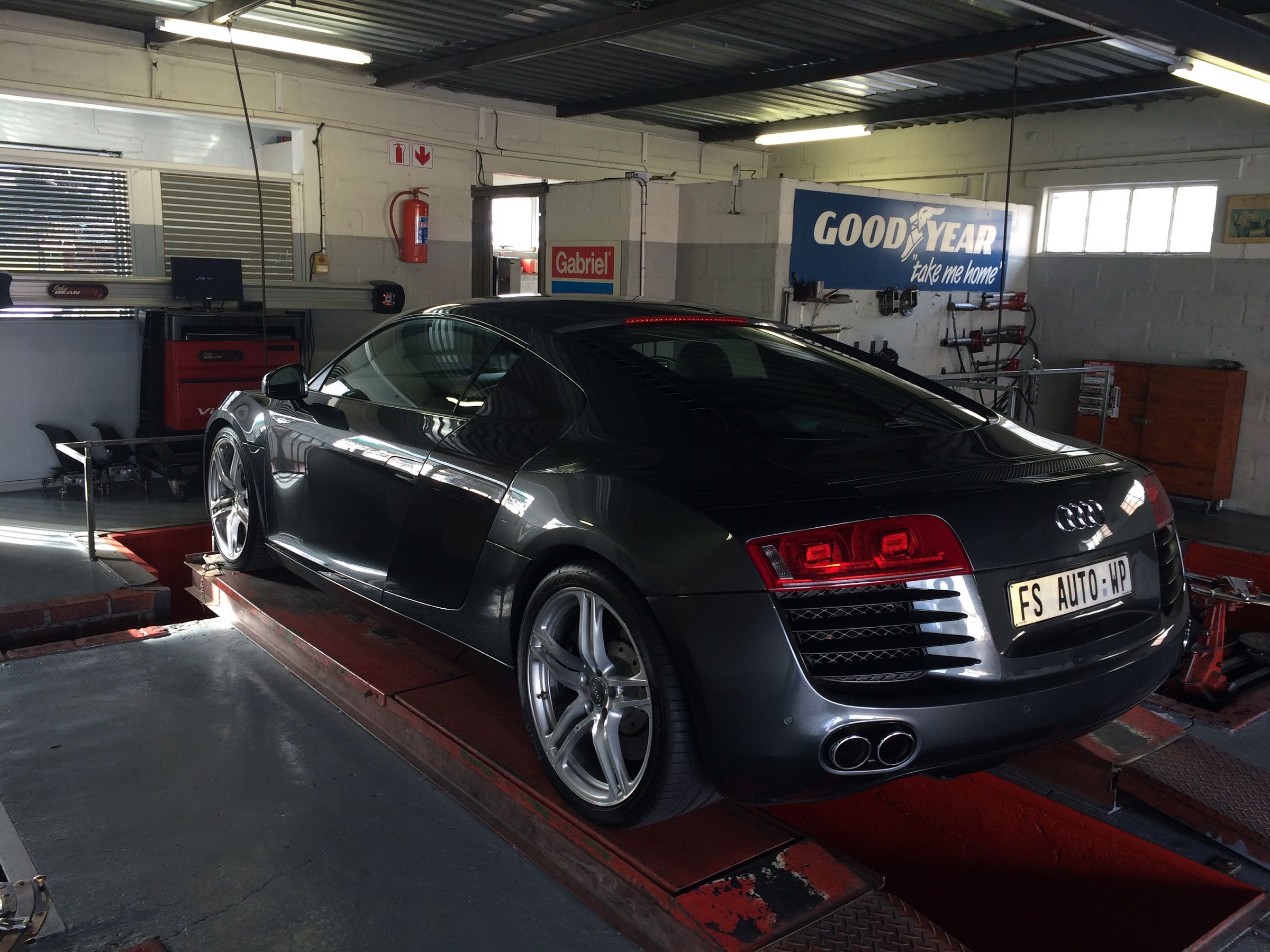 Audi R8 on the wheel alignment bay inside the 5th Avenue workshop