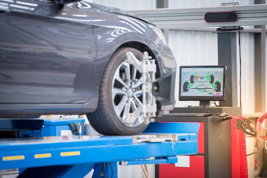 Computerised wheel alignment heads fitted to a wheel